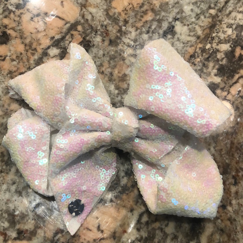 JoJo white iridescent sequin bow